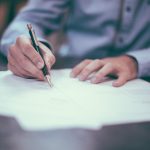 Person reviewing 401k rollover paperwork for annuity purchase